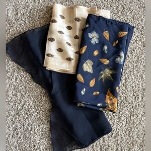 Floral and Leaf Patterned Scarves in Shades of Blue.
